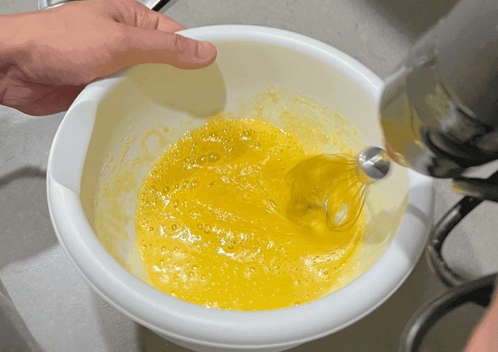 Whip white sugar, vanilla, and egg