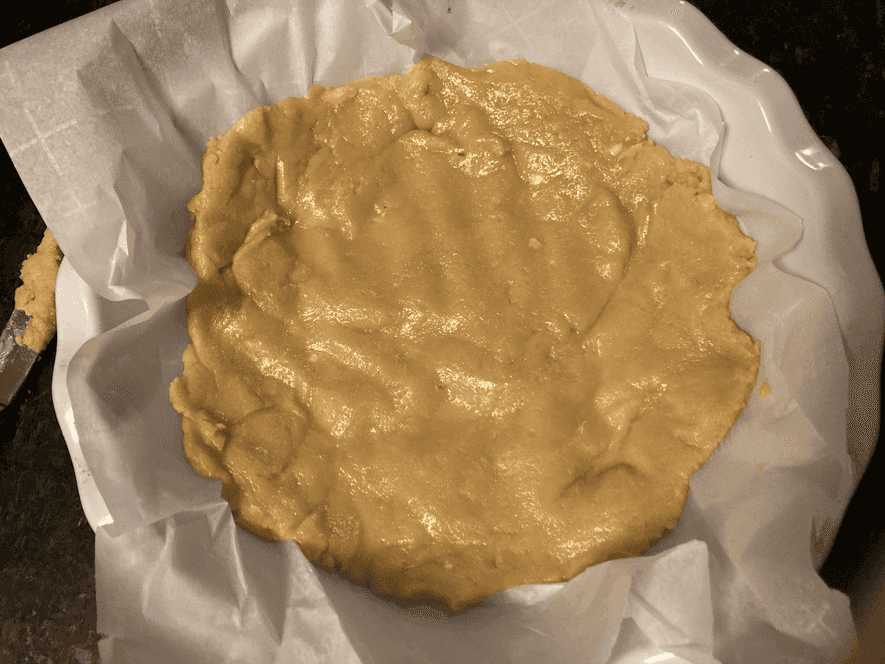 Spread lower layer of dough